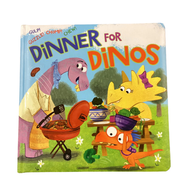 Children's book titled 'Dinner for Dinos' on a wooden surface