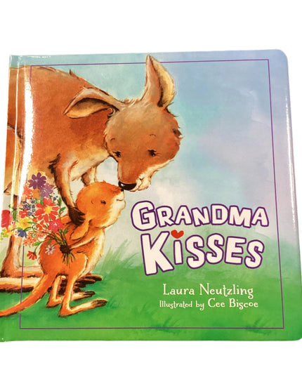 Book titled 'Grandma Kisses' with kangaroo illustration on a wooden surface