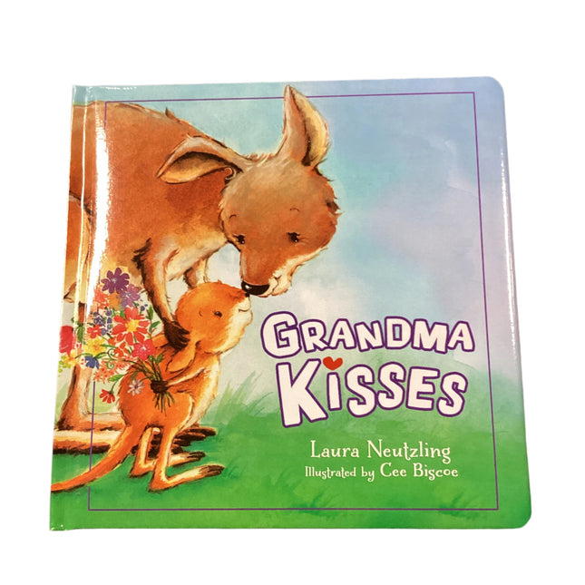 Book titled 'Grandma Kisses' with kangaroo illustration on a wooden surface