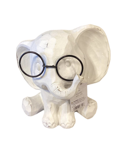 White ceramic elephant figurine with a black glassses