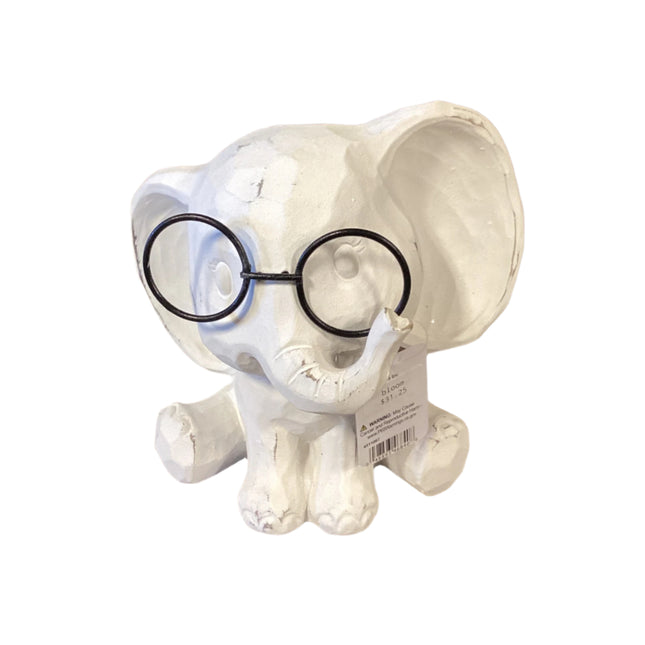 White ceramic elephant figurine with a black glassses