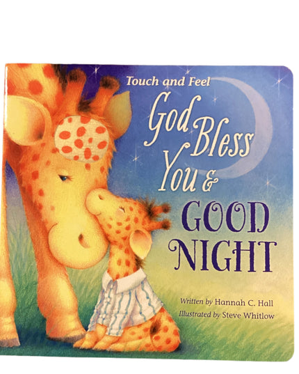 Children's book titled 'God Bless You & Good Night' with a giraffe illustration on a wooden surface.