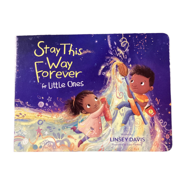 Children's book titled 'Stay This Way Forever for Little Ones' on a wooden surface